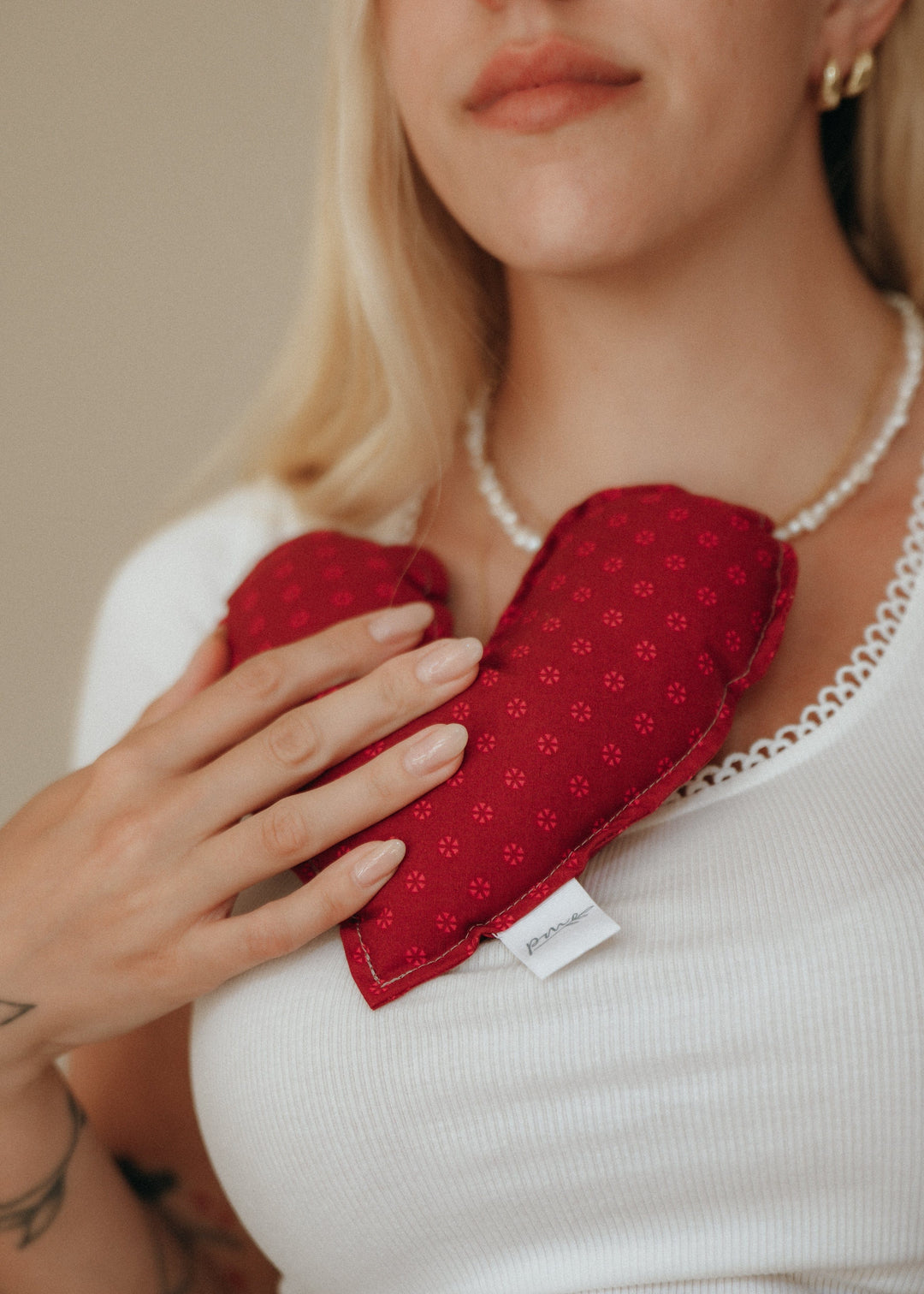 A handmade weighted Heart of Hope held close, a sympathy gift that lasts longer than flowers