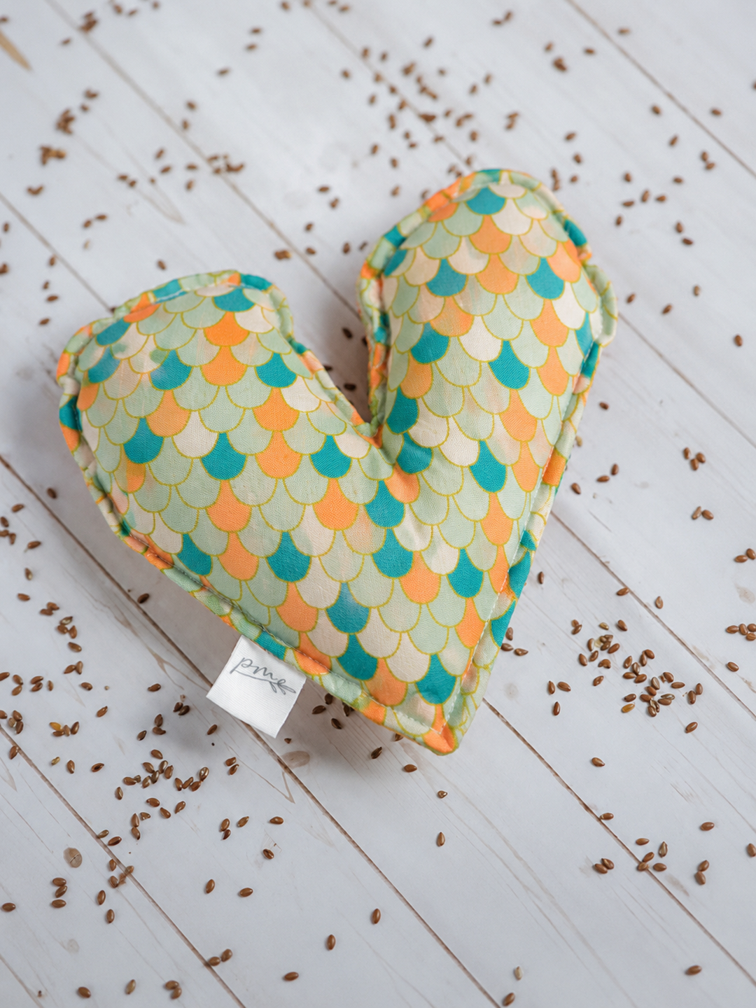 Mermaid Heart of Hope weighted comfort heart with teal and coral scale print