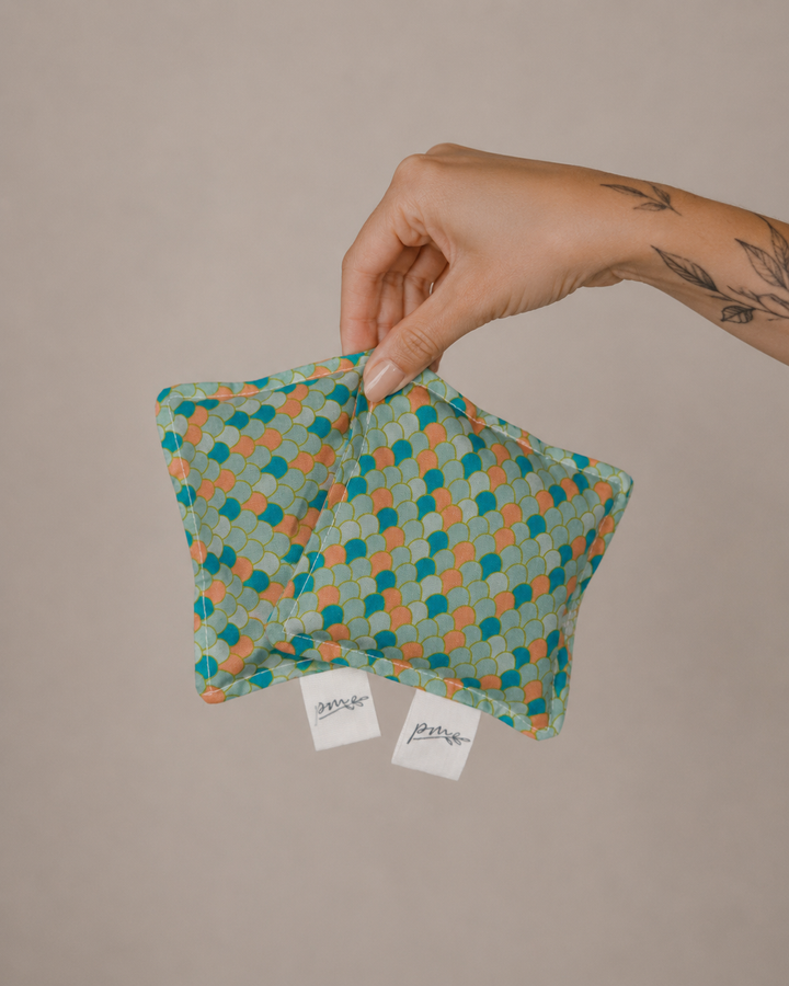 Mermaid square weighted sensory fidgets with teal and coral scale print, set of two