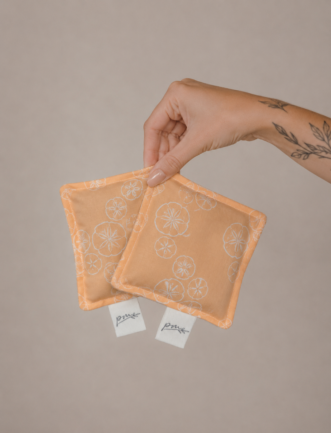 Treasures square weighted sensory fidgets with peach sand dollar print, set of two