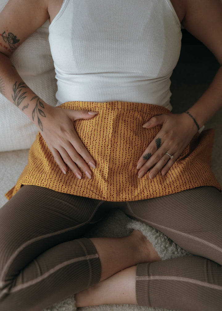 The Perimenopause Reset: weighted Body Wrap draped over neck and shoulders