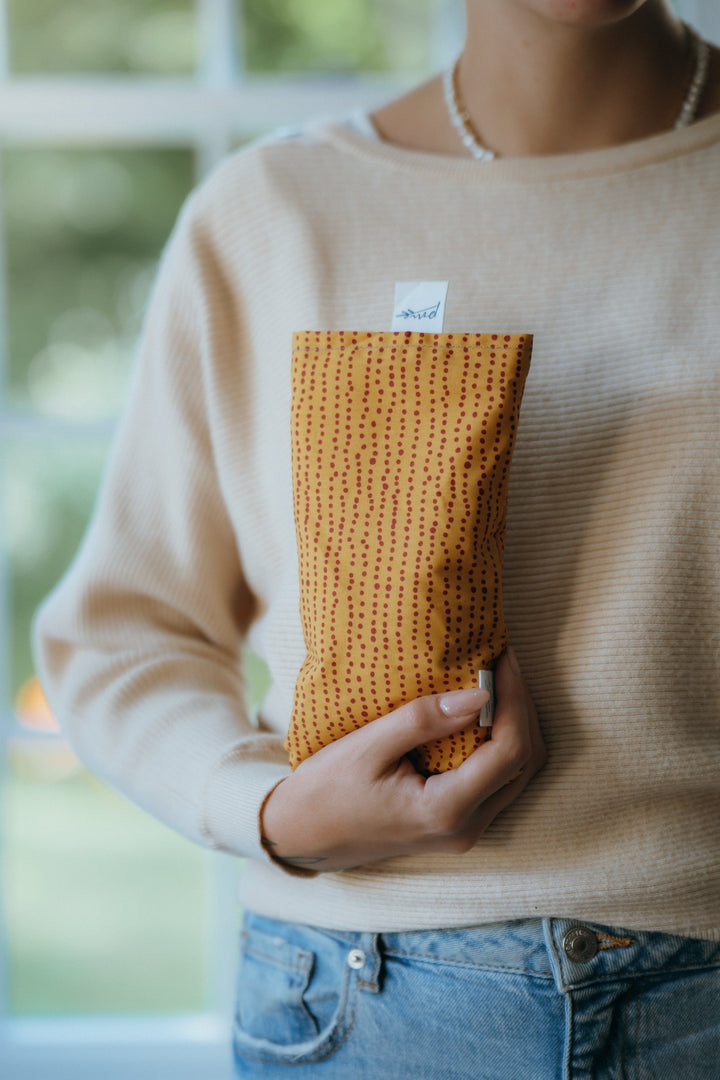 Weighted Eye Pillow over closed eyes, part of The Settle In Set