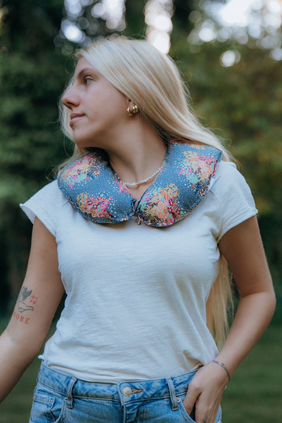 Weighted neck pillow resting across the shoulders, part of the Color and Calm set